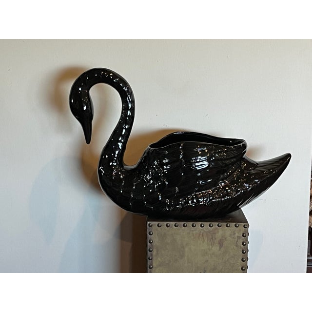 Elevate your space with this magnificent, oversized black ceramic swan. Standing 13" high and 20" wide, this is a rare,...
