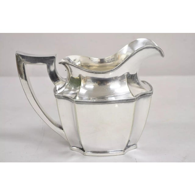 Vintage Wilcox SP Co Art Deco Silver Plated Bulbous International Water Pitcher. Circa Mid 20th Century. Measurements:...