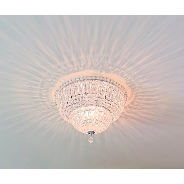 Round French Empire style faceted crystal flush mount ceiling light fixture. This domed tiered fixture features strands of...