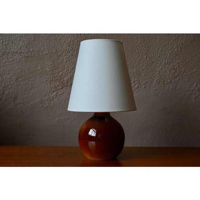 A beautiful, soulful table lamp, crafted by Ateliers du Genetiel, a French artisan manufacturer whose ceramic expertise...