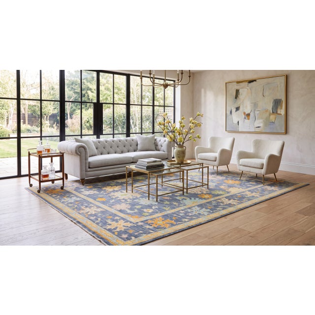 Elevate your space with this exquisite Modern Oushak Style Hand-Knotted Wool Area Rug, designed to bring timeless luxury...