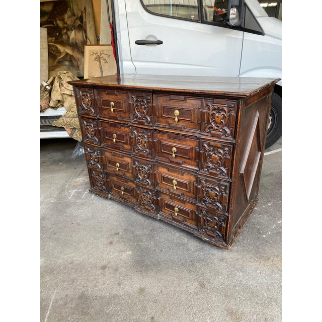 English 18th c oak geometric four drawer marriage chest. Rectangular planked top with molded edge above four geometric...