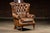 Traditional vintage wingback armchair. This piece features plush button tufts and a comfortable seat cushion. Years of use...