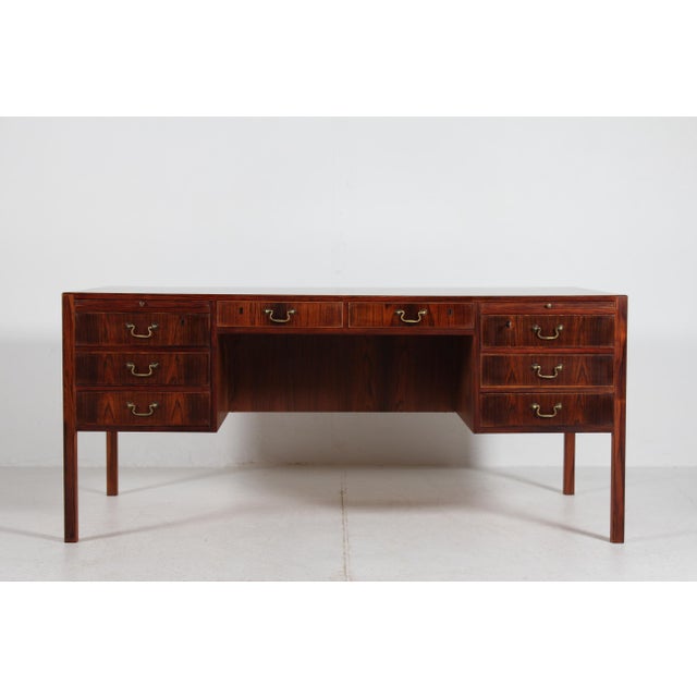 Free standing writing desk of rosewood with oil treatment and lacquer most likely designed by Ole Wanscher (1903-1985)....