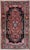 Hand-knotted village rug from the Hamadan region of western Iran, featuring a series of connected geometric medallions...