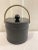 Gorgeous, black leather pinstripe ice bucket. Brass accents including interior of handle.