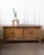 A commanding Danish oak sideboard by Henning Kjærnulf, produced in the 1970s and measuring just over 78 inches wide — a...