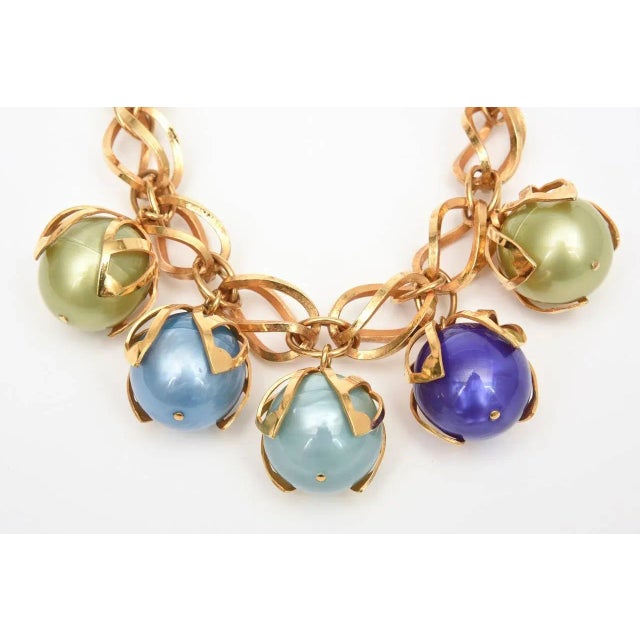 This theatrical and show stopper statement French necklace by Dominique Aurientis has 4 large balls of resin that are...