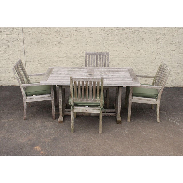 High Quality Teak Outdoor Patio Dining Set Featuring A Rectangular Slatted Top Dining Table With Umbrella Opening And Four...