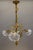 Elegant French Art Nouveau chandelier with sculptural bronze irises and opalescent glass shades. This refined French Art...