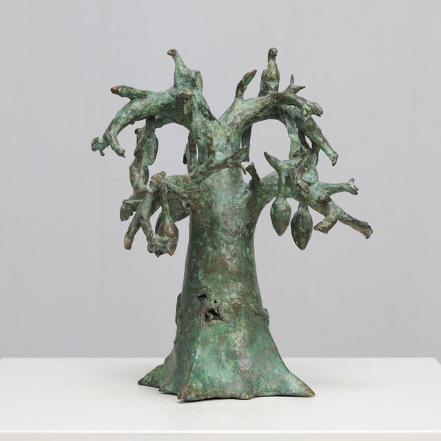 A playful and highly decorative bronze sculpture depicting a baobab tree inhabited by numerous birds. Cast in bronze and...
