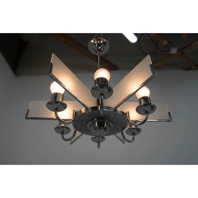 6-flaming Art Deco chandelier. Sandblasted glass in a perfect condition. Chrome with minor age patina - polished. Rewired:...