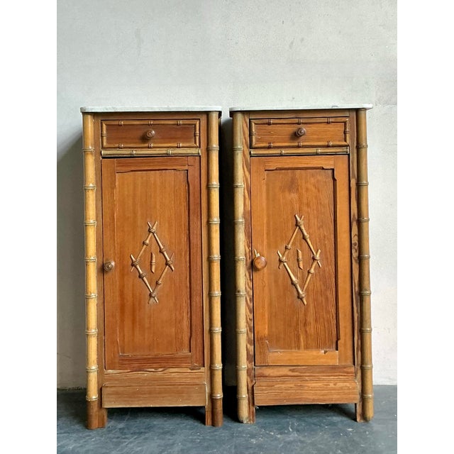 This exceptional pair of vintage nightstands perfectly captures the exotic fusion of Chinoiserie style and Hollywood...