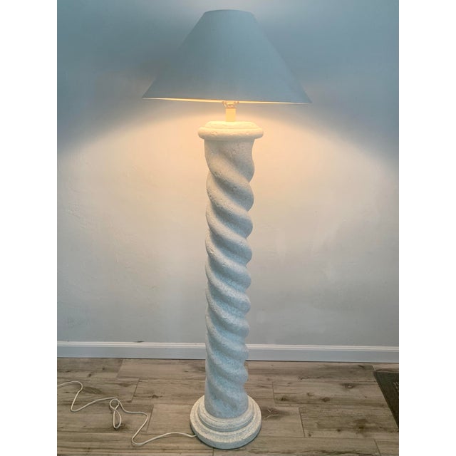 Sculptural plaster floor lamp in the style of Michael Taylor. Sporting a spiral column design with a round base. Textured...