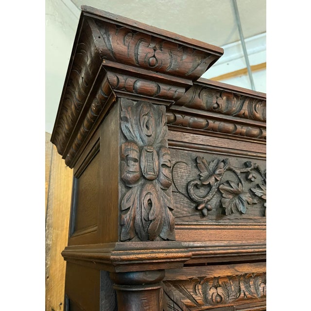 Beautiful carved bookcase in the Black Forest style - excellent quality with fine door panels and carved cornice and base....