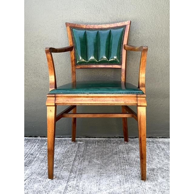 Bring a touch of Mid-Century elegance to your workspace with this sophisticated Art Deco-style armchair. Expertly crafted...
