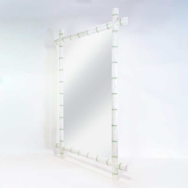 This vintage French wall mirror captures the timeless charm and rustic elegance of early 20th-century European design. The...