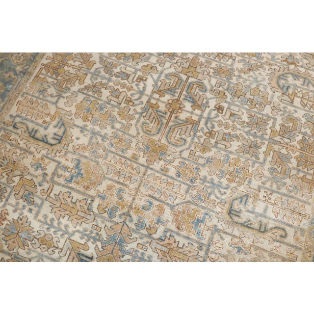 An early 20th Century Square small room size Persian Heriz rug with an all-over design on a ivory ground. Professionally...