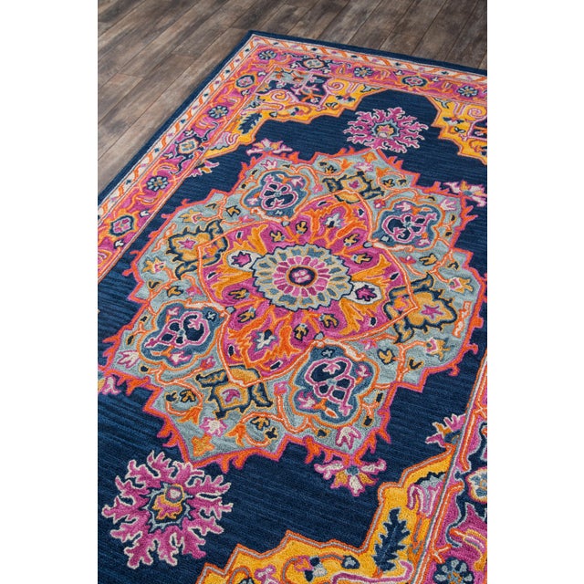 The saturated shades of this decorative area rug reinvent the classic Persian carpet in a vivid color palette. The...
