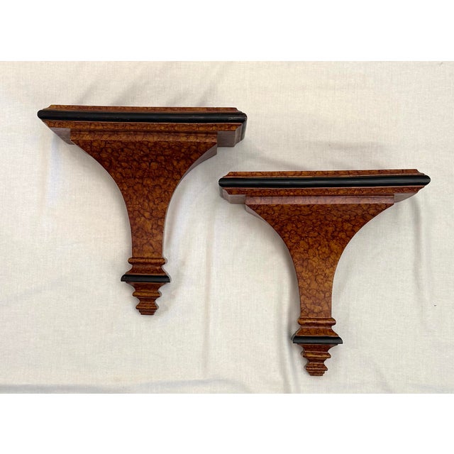 Inspired by classical European architectural brackets this pair encompasses a faux marbled tortoiseshell finish and dark...