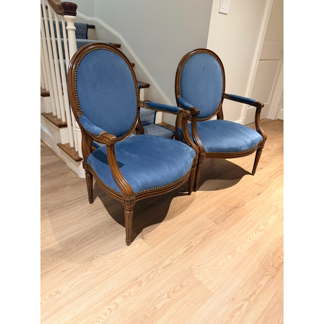 Pair Blue Louis Style Armchairs Perfectly proportioned with a wide comfortable seat and back. The vibrant blue ultra suede...