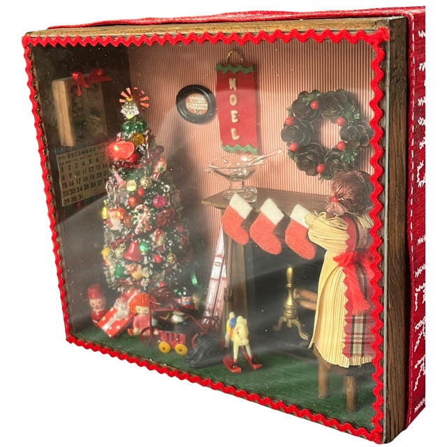 A wonderfully nostalgic handmade Christmas diorama capturing the magic of a vintage holiday season. Encased within a...