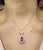 A stunning platinum pendant necklace showcasing modern elegance. This exquisite piece features a 1.97-carat natural pear-...