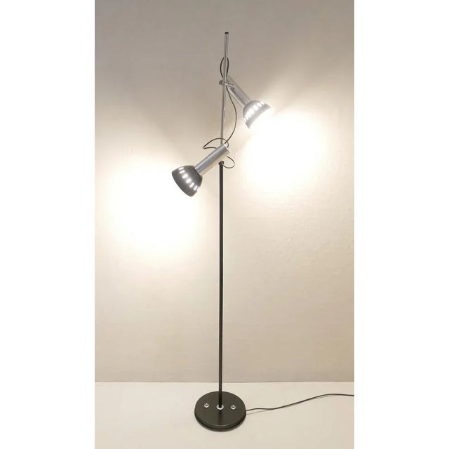 Adjustable floor lamp with chromed metal structure, with 2 sliding lampshades and double switch. Made in Italy in the...