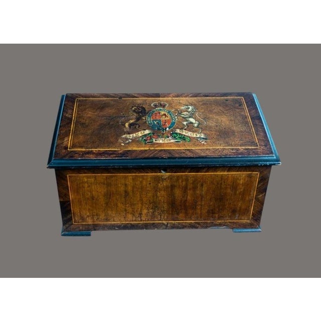 A fine 19th-century Swiss cylinder music box with bells, housed in an attractive figured walnut case and representing the...