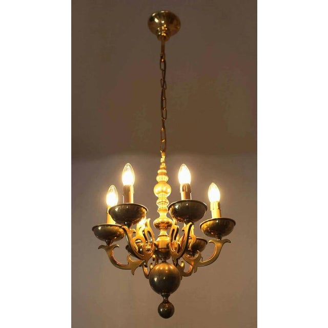 The chandelier is cast from brass with surface wiring. A radiant chandelier that cannot be overlooked. Restored electrical...