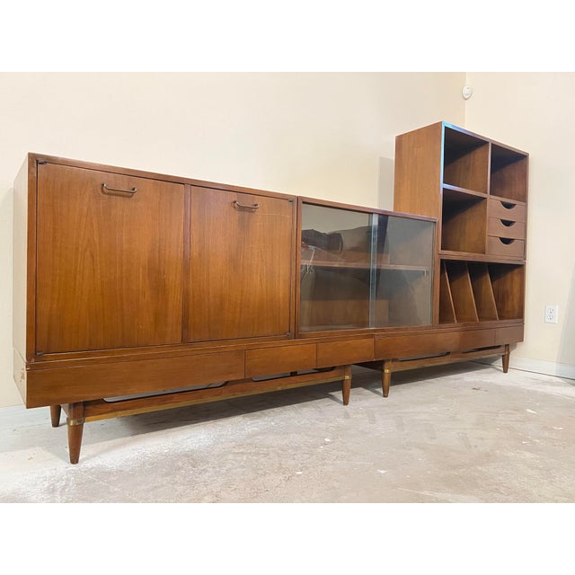 Mid Century Console by Merton Gershun / American of Martinsville furniture company. The lower sturdy conical legs have...