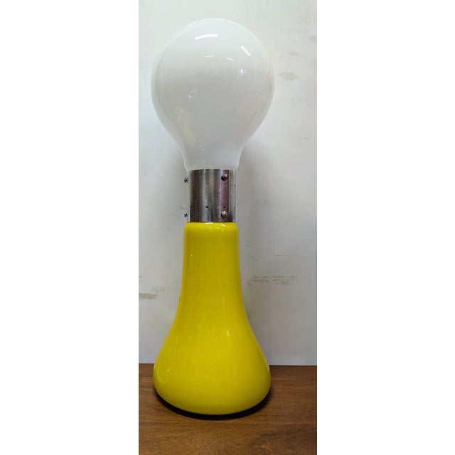 An important and iconic floor lamp made of two-tone glass, in transparent lattimo and canary yellow. A rare, original...