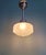 Art Deco frosted glass pendant light with a chrome-plated metal frame, 1920s-30s. The pendant light has been rewired and...