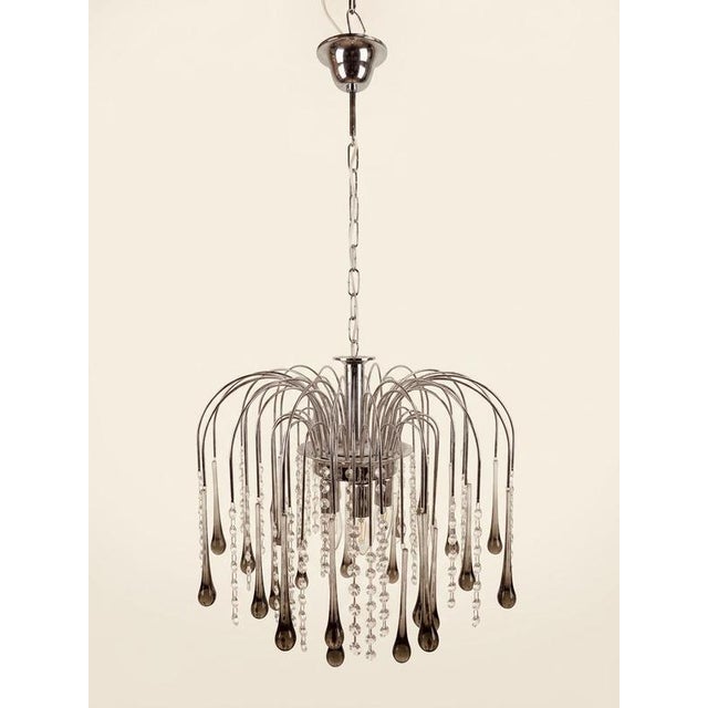 Elevate your interior with this exceptional, Paolo Venini design Murano chandelier, a standout example of 1970s Italian...