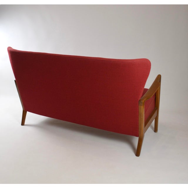 Elegant danish modern seating set designed by søren hansen for fritz hansen, comprising a two-seat sofa and matching...