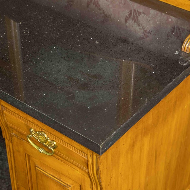 A large Edwardian washstand. The quality of the carved panels to the back are outstanding and the fixed mirror back is an...