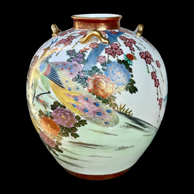This antique Japanese Satsuma-style vase dates to the Meiji period (1868–1912) and features an elaborately hand-painted...
