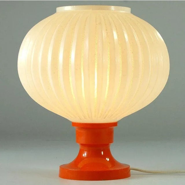 A very decorative Space Age lamp from the 1970s. The base is made of colorful plastic. Shape shade. Bulb frame E14, cable...