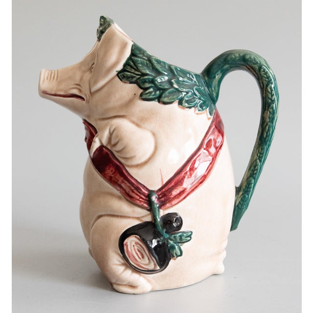 A charming antique French majolica barbotine pig pitcher by Orchies, circa 1920. Maker's mark on reverse. This highly...