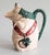 A charming antique French majolica barbotine pig pitcher by Orchies, circa 1920. Maker's mark on reverse. This highly...