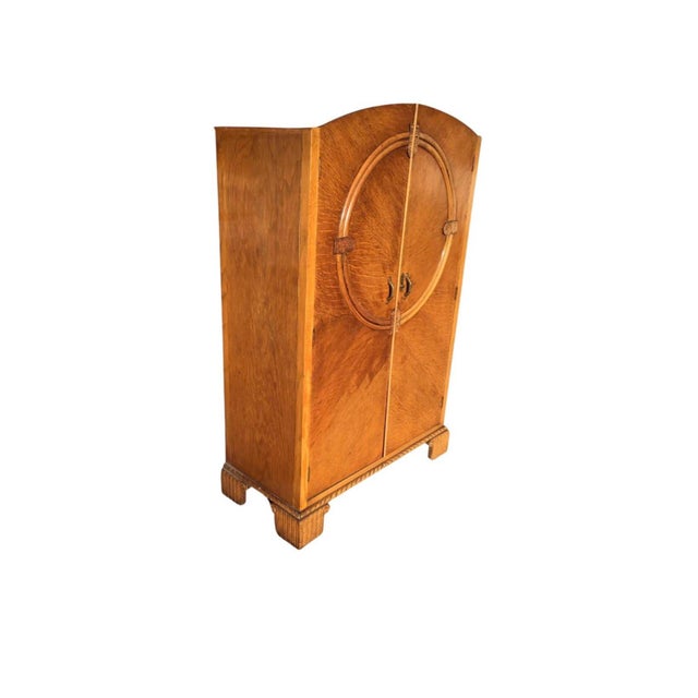 Striking Art Deco wardrobe crafted in the early 1930's, showcasing bold architecture geometry and refined craftsmanship....