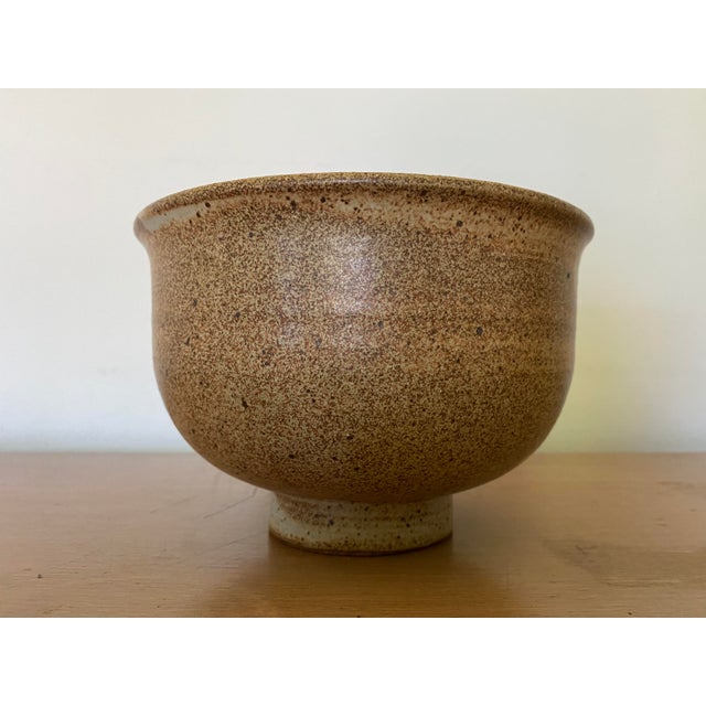 A beautiful midcentury stoneware bowl with flaring rim. This bowl is extremely well potted, undoubtedly the work of an...