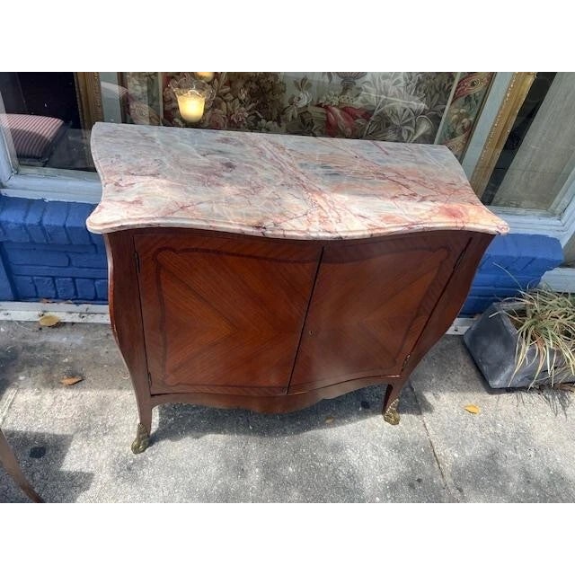 The Antique French Serpentine Mahogany 2 Door Cupboard is a stunning piece of architectural history from the 1900s....