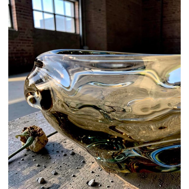 Vintage smoked glass bowl produced by holmegaard in denmark. the bowl is executed in softly smoked brown glass and formed...