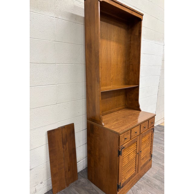 This is a gorgeous vintage Ethan Allen Heirloom Nutmeg Maple Custom Room Plan 30” CRP shutter door cabinet with hutch or...