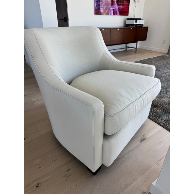 Classic, transitional lounge chair with tightly upholstered back and subtle winged shaping. Deep single loose seat cushion...
