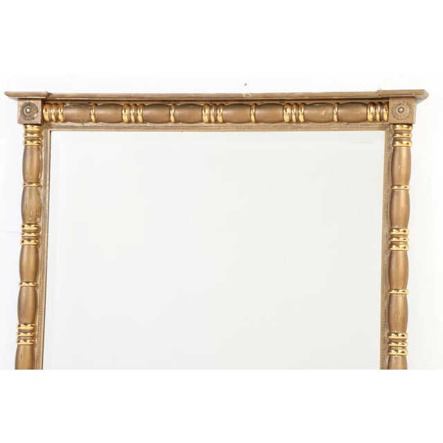 Antique mirrors of this size and quality are very hard to find. This statement piece dates to the late 19th century....