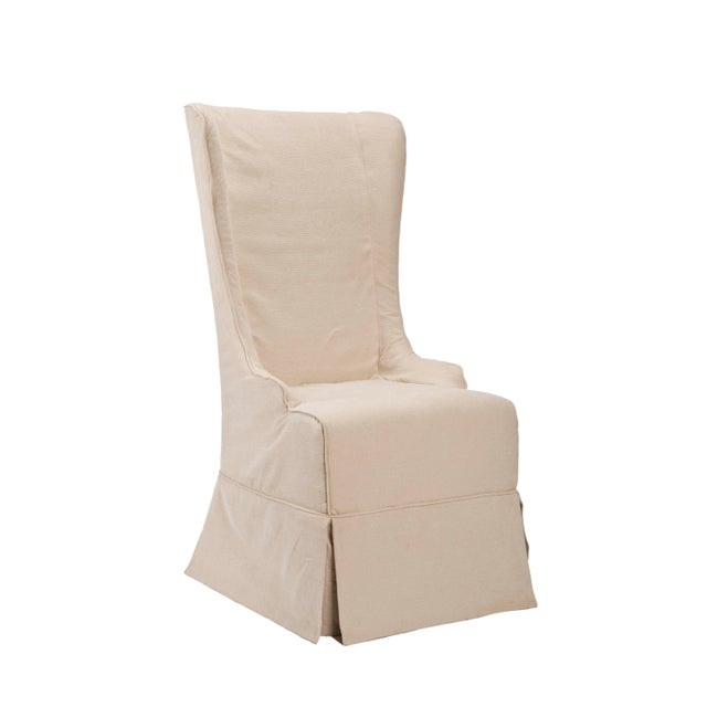The slip-covered Bacall high back chair, in natural cream, absolutely commands attention. With a reaching, slightly...