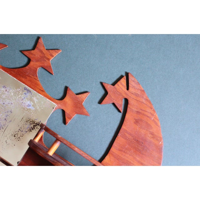 An amazing folk art wall shelf with moons, stars, stairs, and a very old mirror. Hangs on the wall. Shelves are great for...