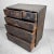 Traditional chest of drawers with five drawers, featuring metal handles and lock plates. This tansu dates back to the...